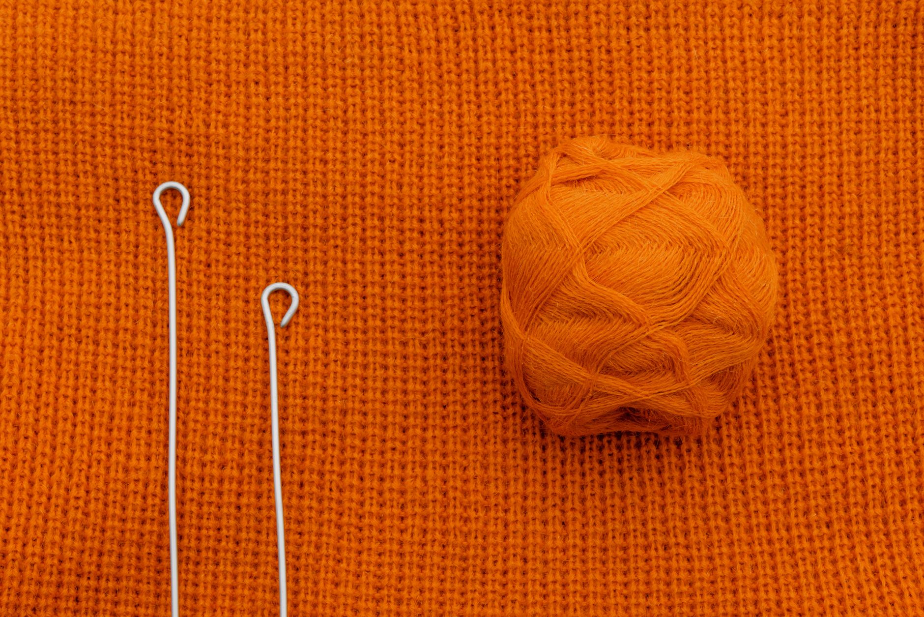 Ball of wool on knitted fabric