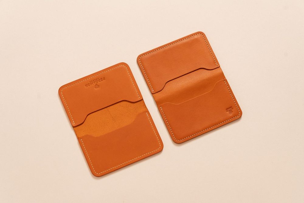 Minimalist leather card holders in a flat lay setting, ideal for stylish organization